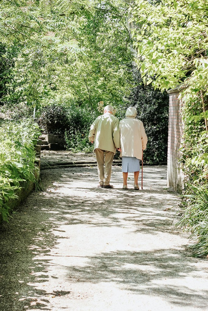 Bulli Community Centre elderly couple walking in garden